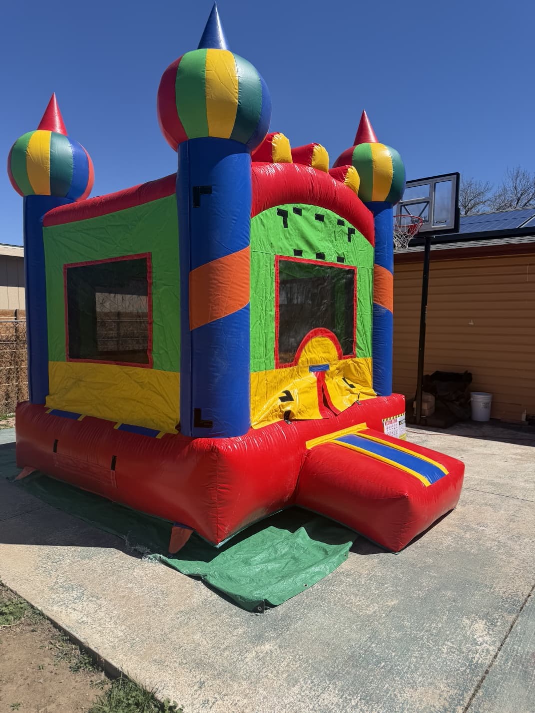 Castle bounce house with slide, side view